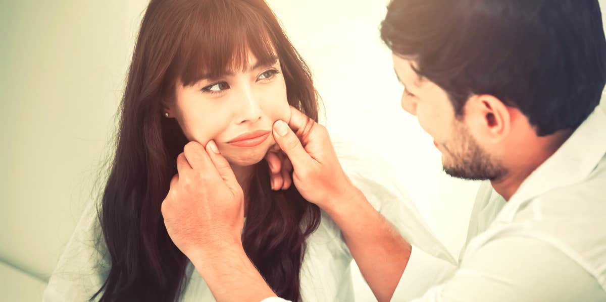 boyfriend trying to make girlfriend smile at joke that is really verbal abuse