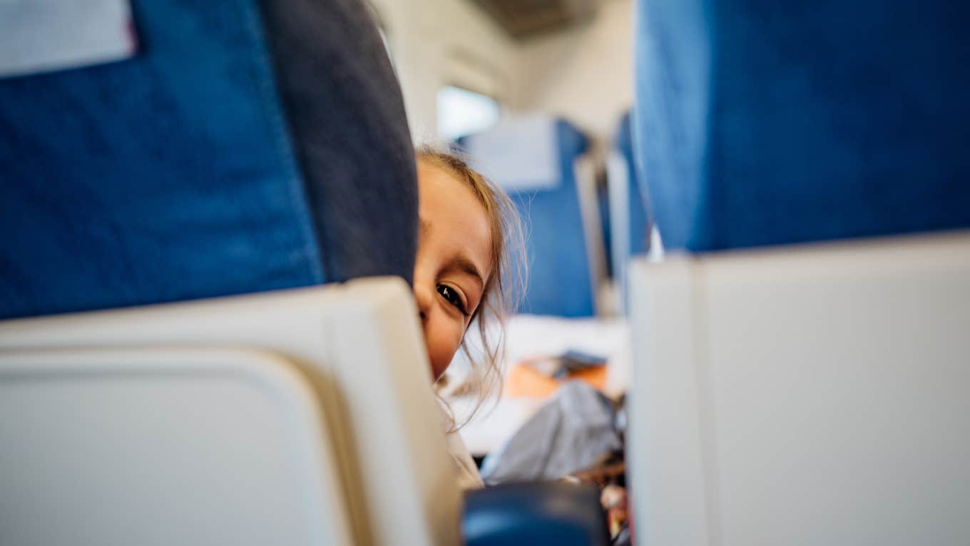 girl reclining her airplane seat