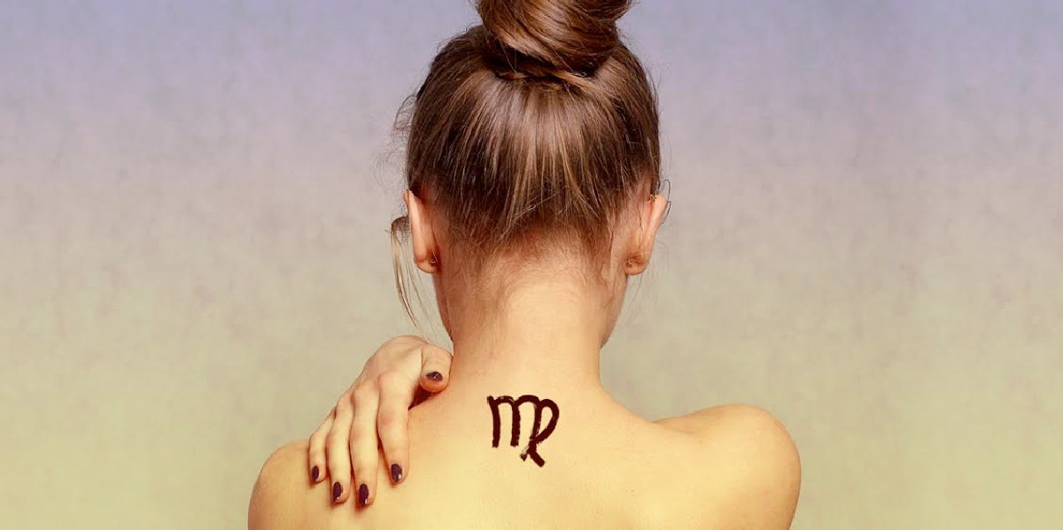 woman with virgo tattoo on her neck