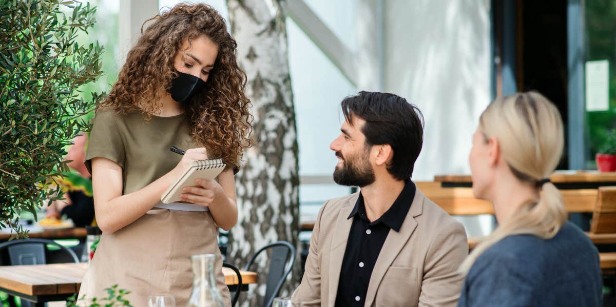 After Waitress Flirts With Her Husband, This Wife Left A Review That Got Her Fired Waitress serving man