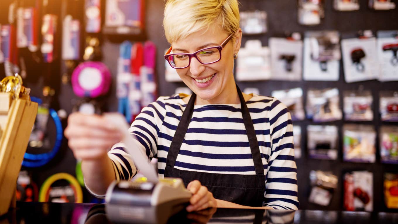 retail worker at cash register