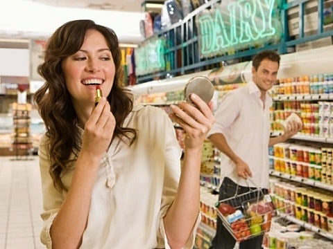 Love Bytes: 20 Places To Find Your Next Boyfriend girl putting on makeup at grocery store
