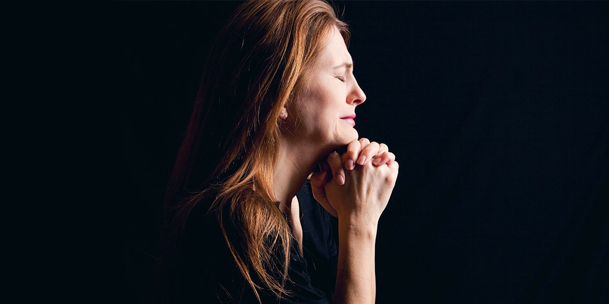 photo of mother in profile with black background