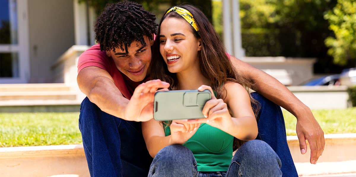 happy couple taking selfie