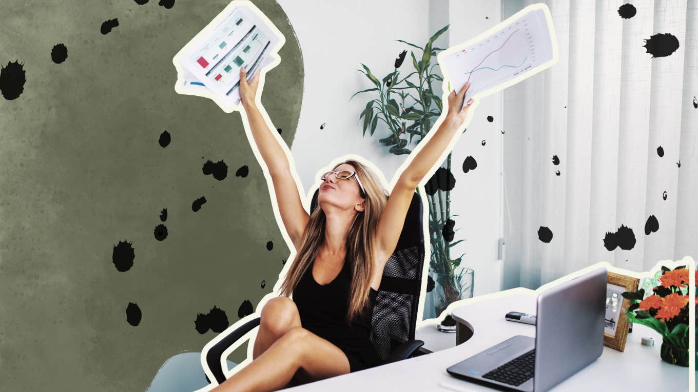 Woman basking in her success at desk 