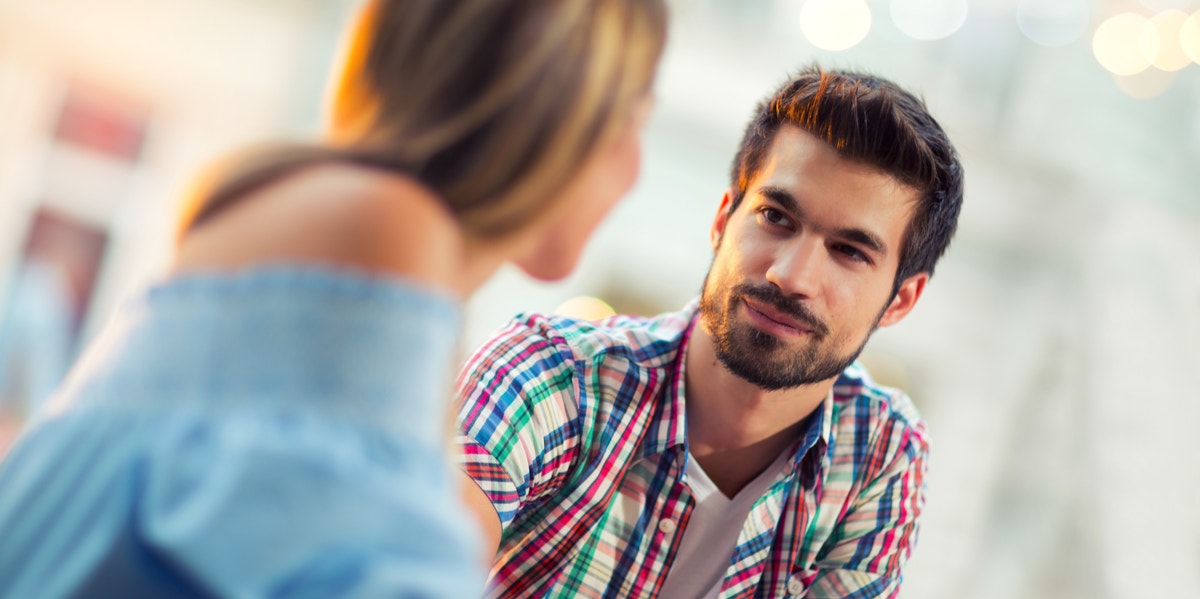 10 Easy Ways To Impress Him On The First Date man and woman starting at each other