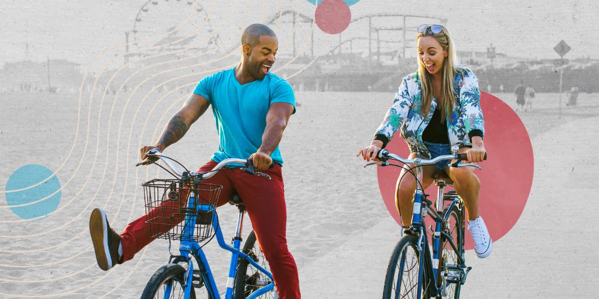 Happy couple riding their bikes on the beach