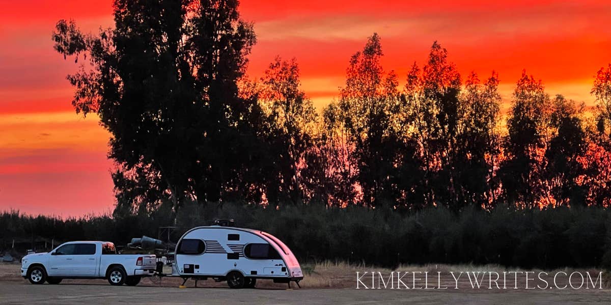 mobile home with sunset in background