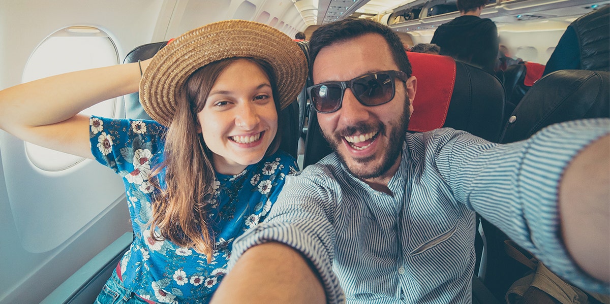 Why I Didn't Miss My Kids At All When I Went On Vacation couple on plane