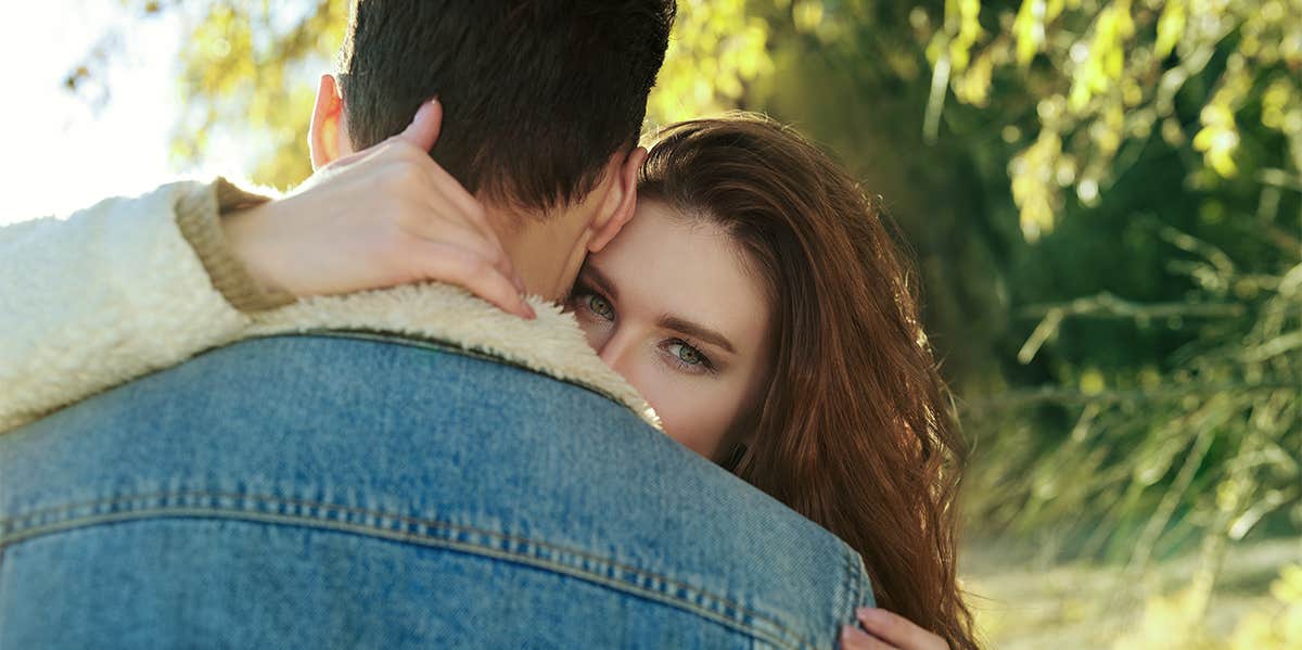 How The 4 Attachment Styles Affect Relationships — And How To Know Which Is Yours woman hugging man
