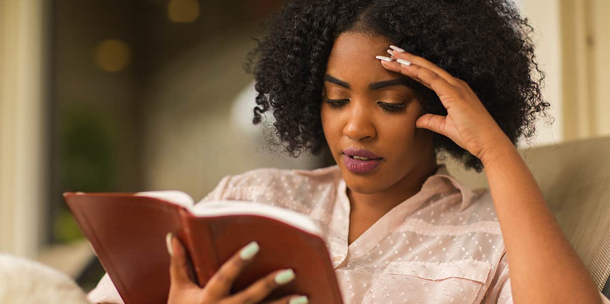What Are The Seven Deadly Sins? Meanings & How To Avoid Temptation woman reading a bible