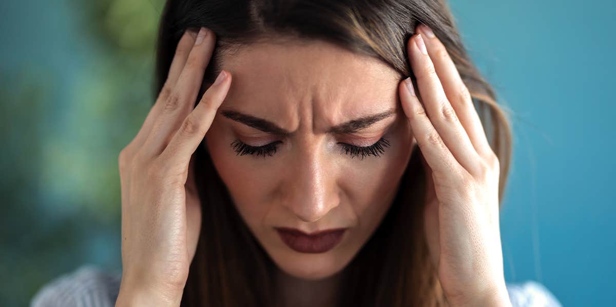 5 Very Weird Reasons You Keep Getting So Many Headaches woman with headache pain