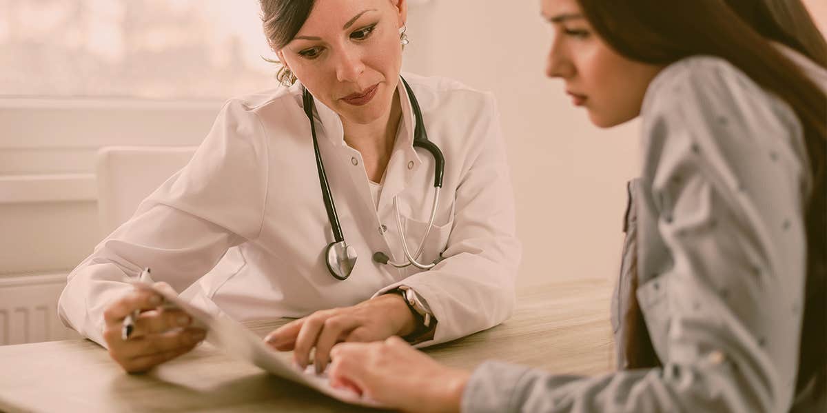 What Cervical Dysplasia Taught Me About The Importance Of Routine Pap Smears woman in a appointment with doctor