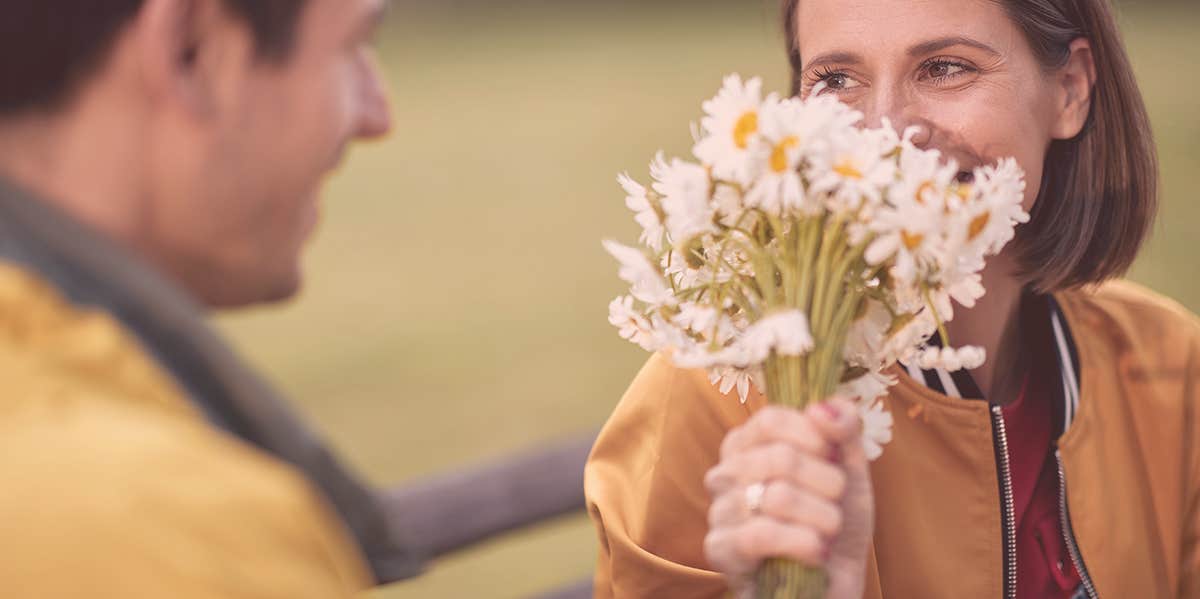 girl receiving flower