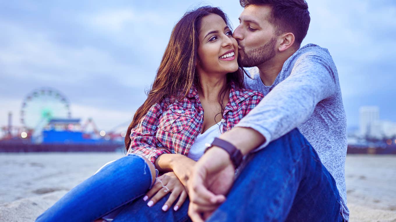 7 Toxic Behaviors Couples Should Avoid This Year If They Want Their Relationship To Last Forever couple sitting on a beach