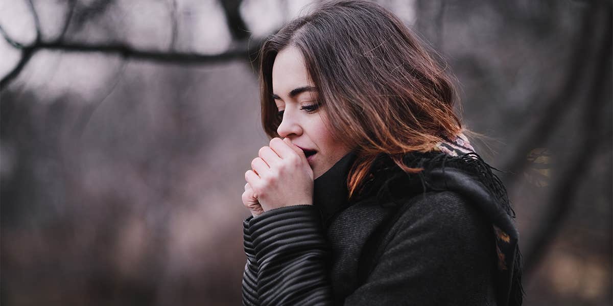 woman warming her hands