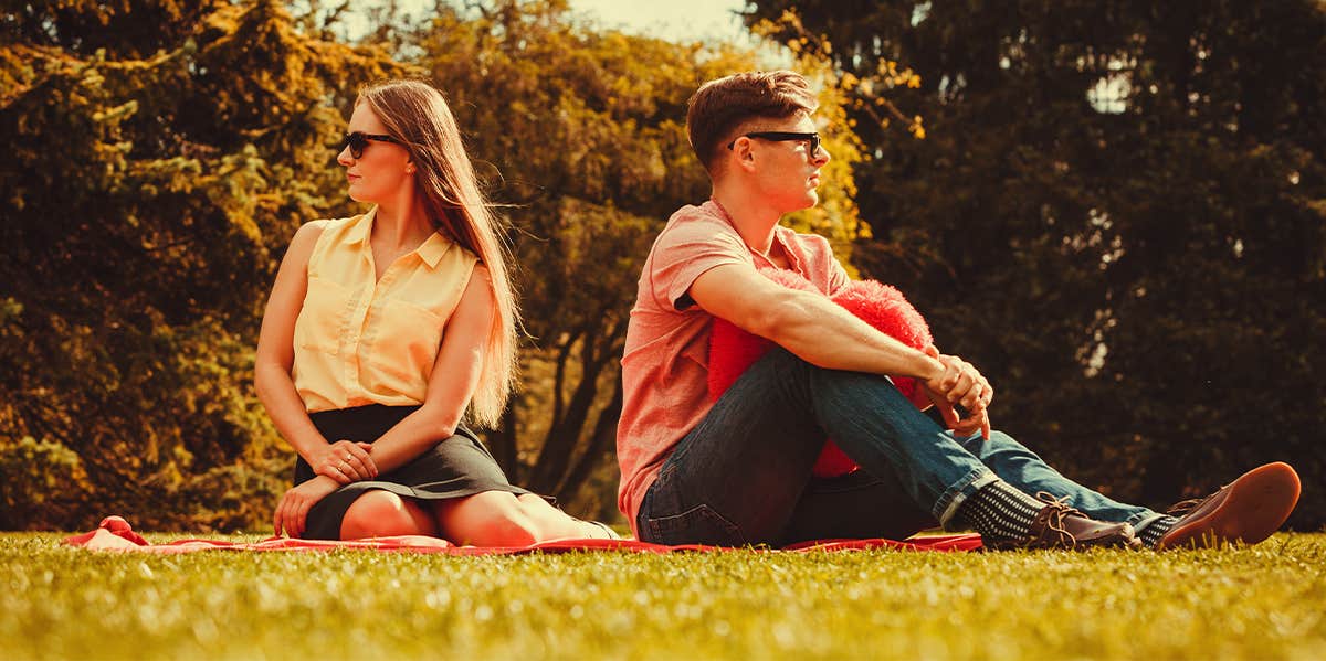 man and woman sitting opposite of each other