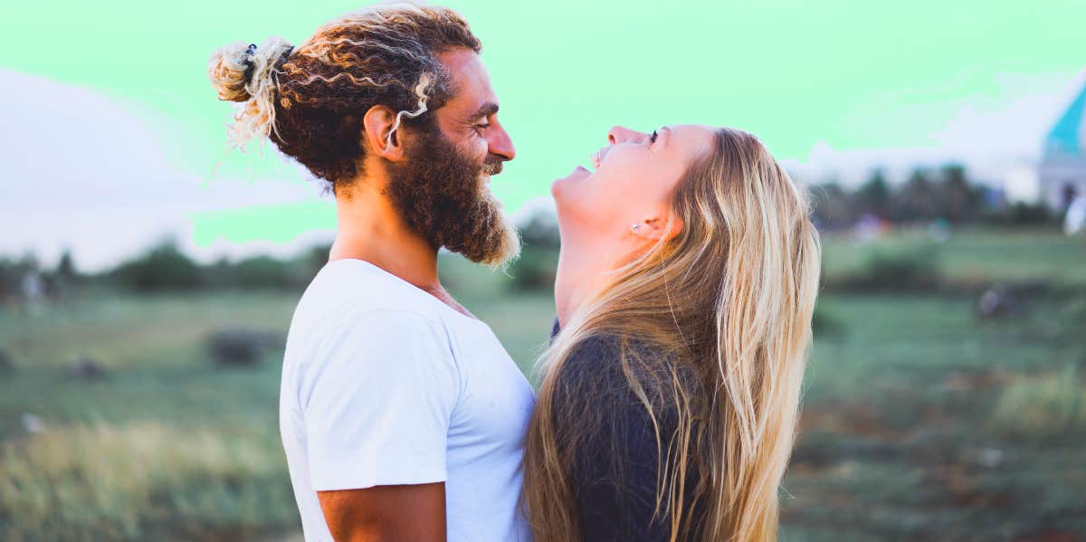 happy couple facing each other with ecstatic facial expressions