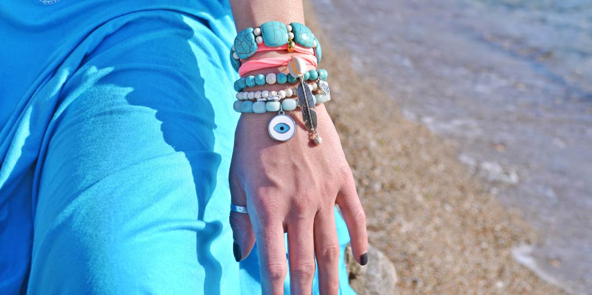 arm with evil eye bracelet