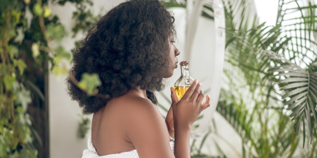 woman using essential oils