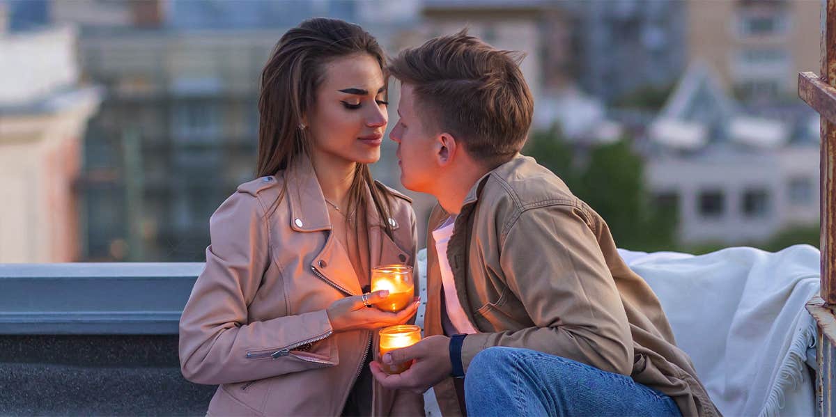 man and woman on romantic rooftop date