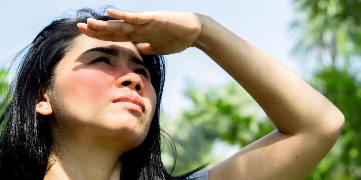 woman looking into the sky