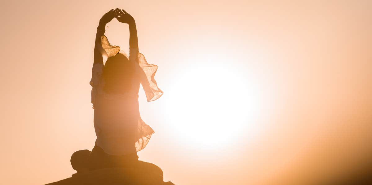 woman meditating in nature