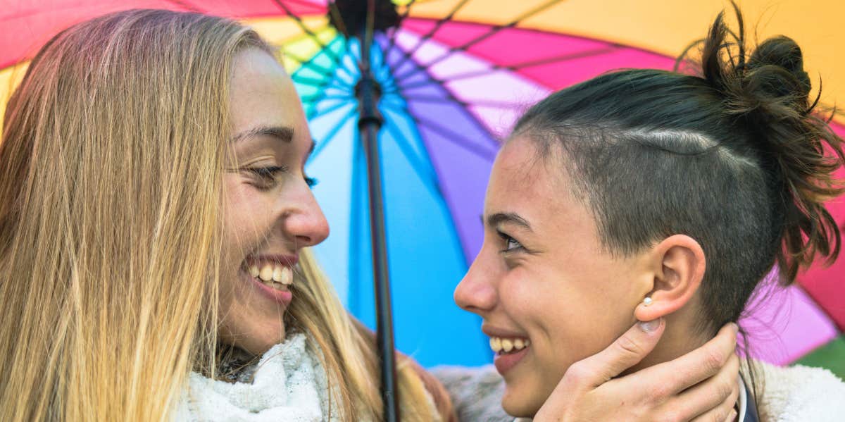 two women smiling at each other