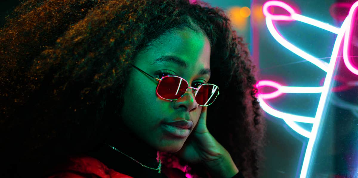 woman posing with neon lights