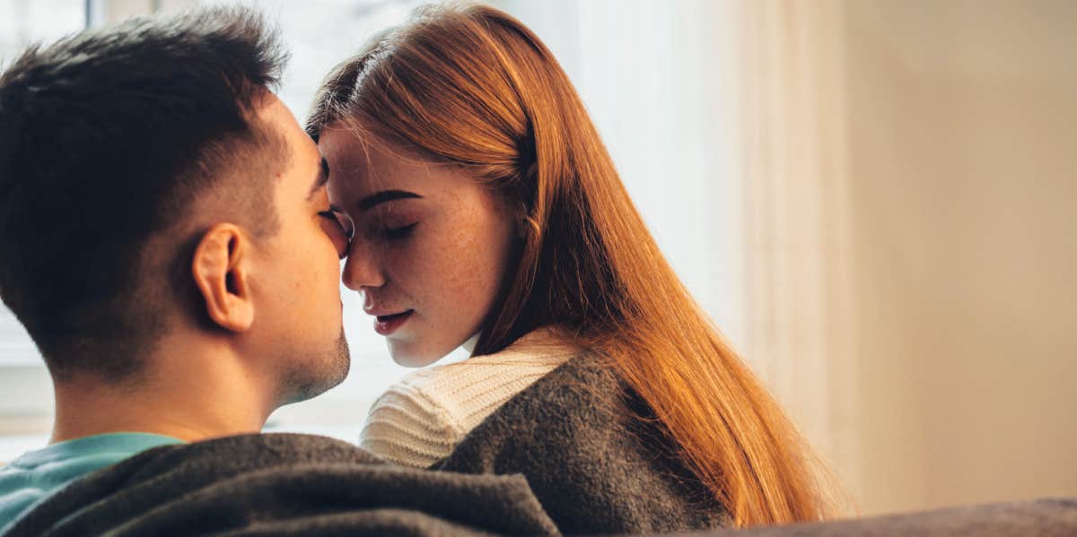 Harsh Things Guys Notice About You In Bed (But Will Never Tell You) man and woman getting intimate