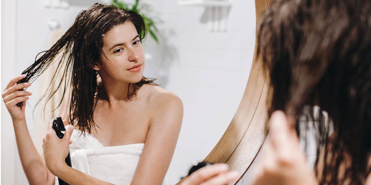 woman using hair product