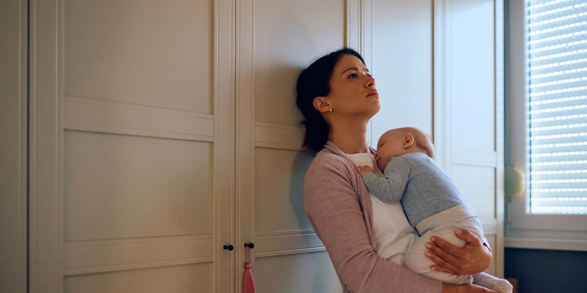 What Happened When I Shared My Raw, Real Postpartum Body On Facebook mom with baby