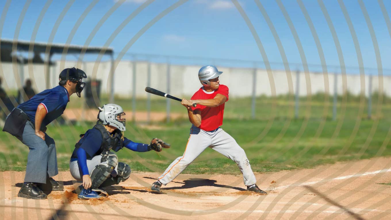 Young man pitching in baseball game