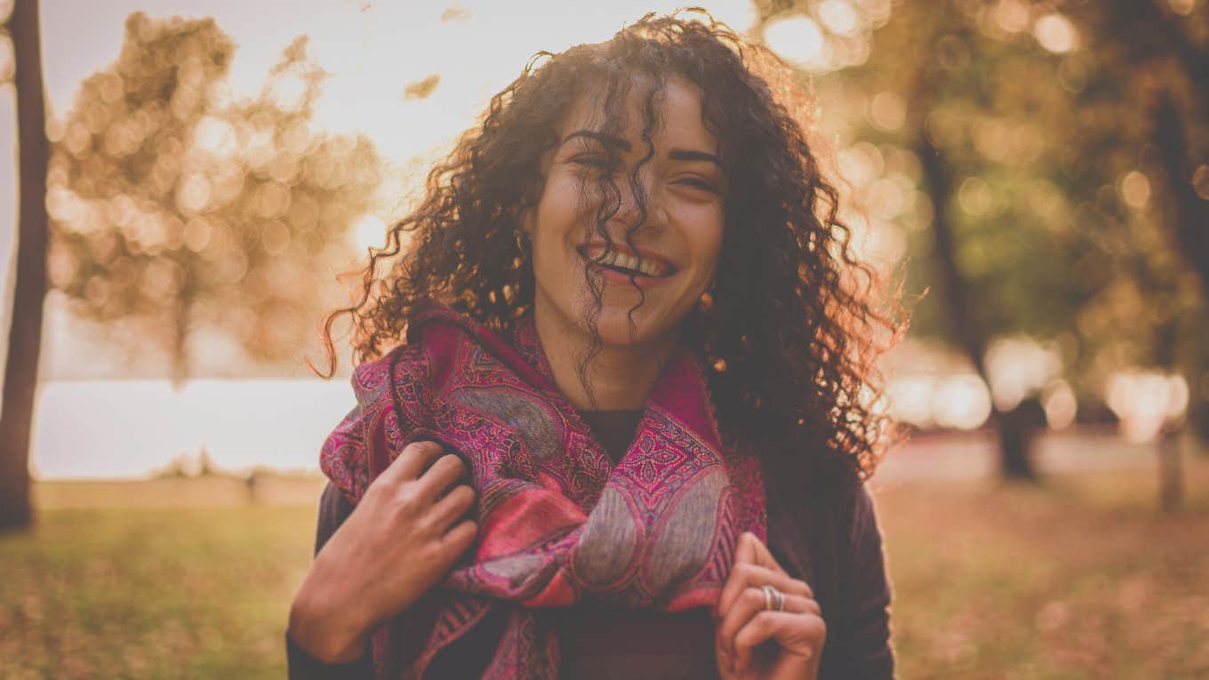 woman laughing outside