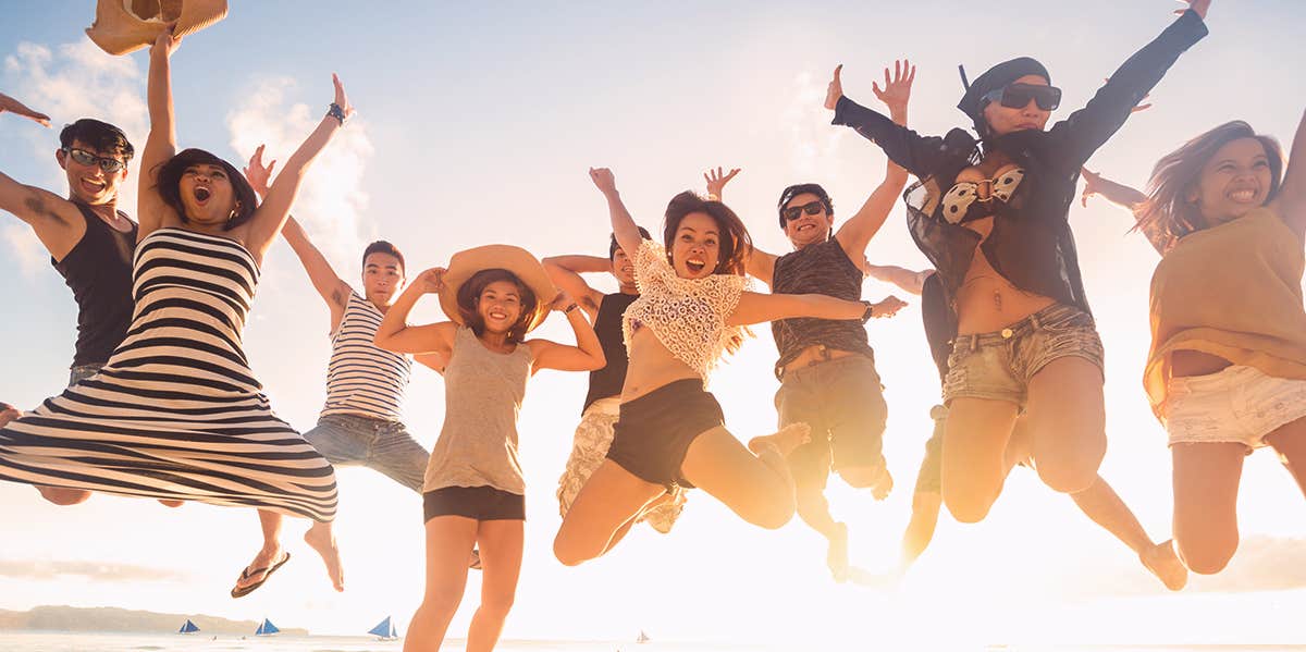 people jumping during sunrise