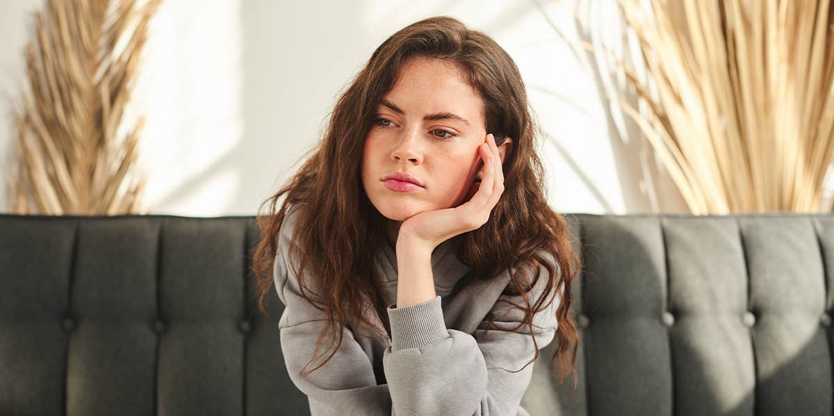 woman sitting thinking