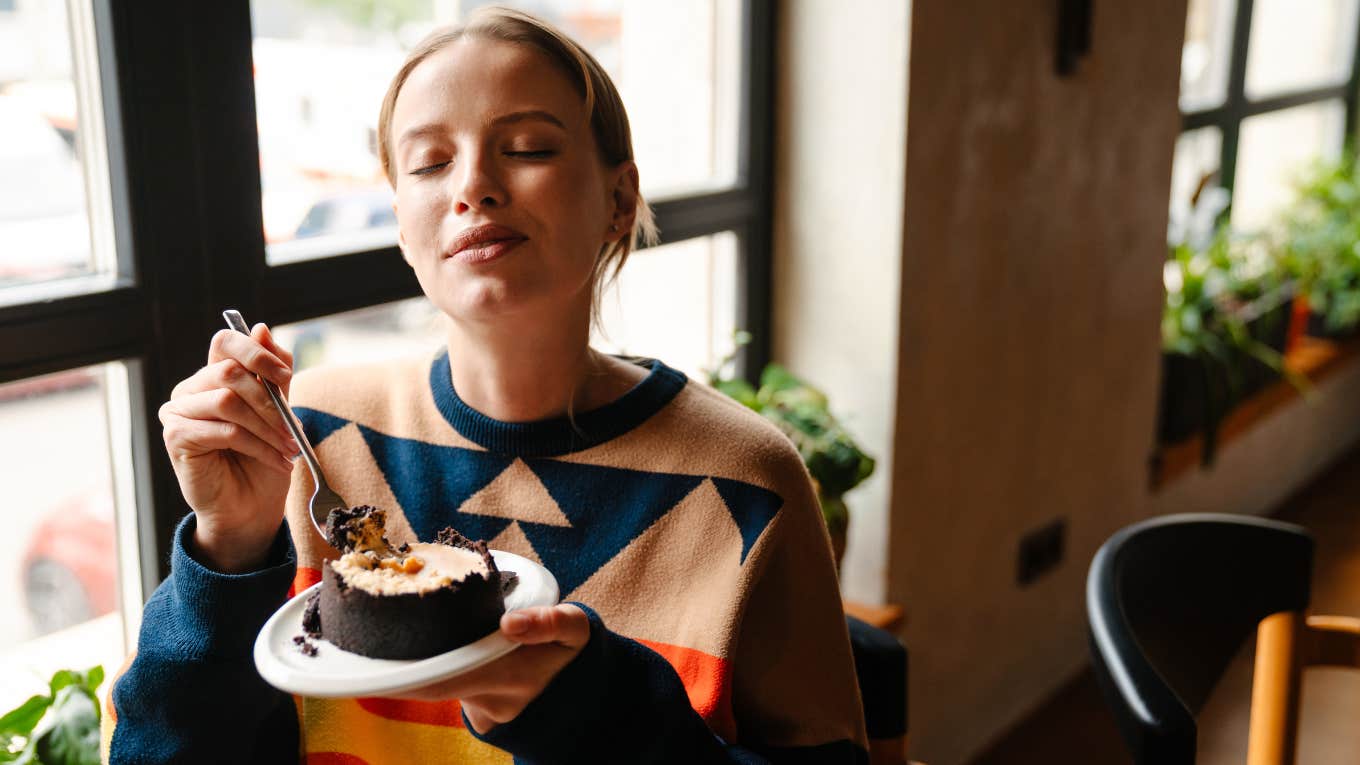 Woman eating what she wants after intermittent fasting