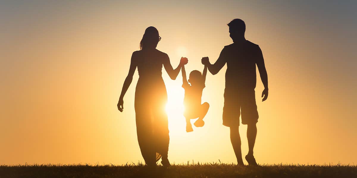 parents walking with toddler