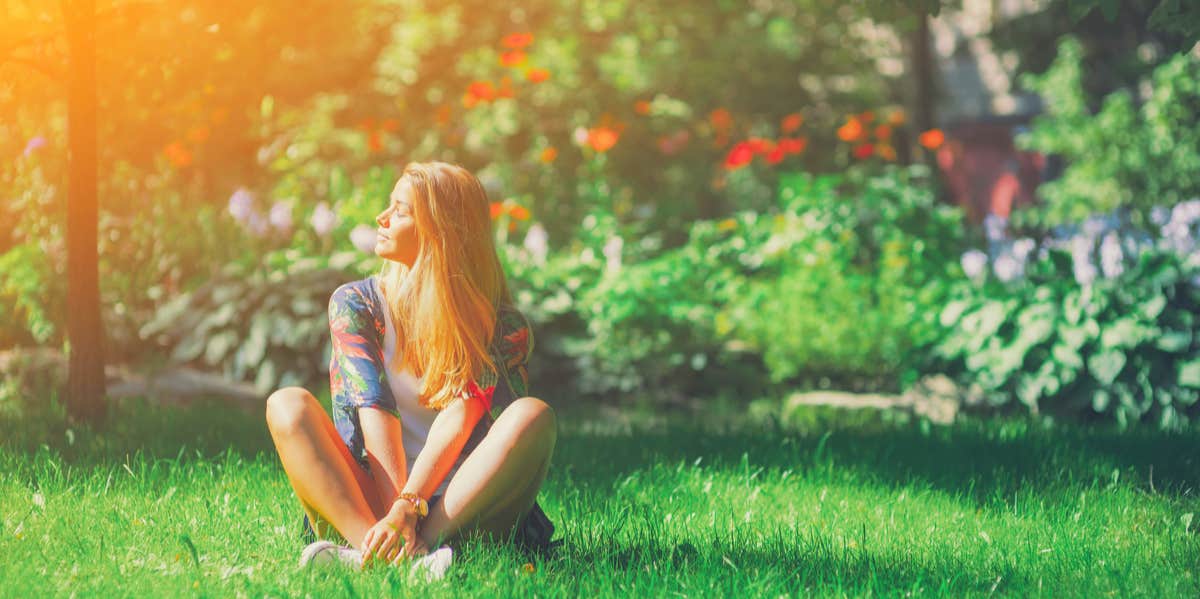 woman sitting in grass