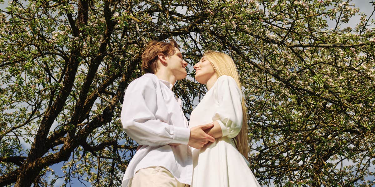 What Is The Law Of Attraction & How To Use It To Find Your Soulmate couple in the woods