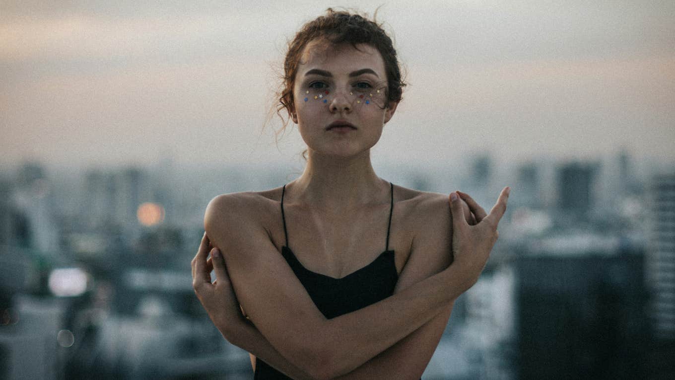 woman standing with arms crossed