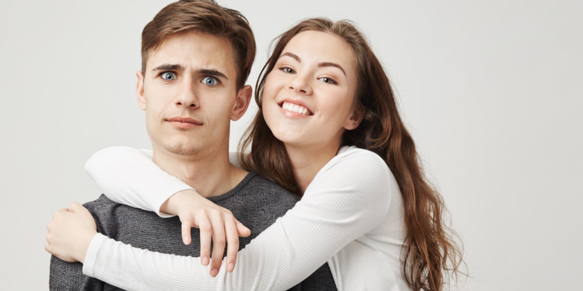What It Really Means To Be The 'Crazy' Girl In Relationships crazy clingy girlfriend hugging boyfriend