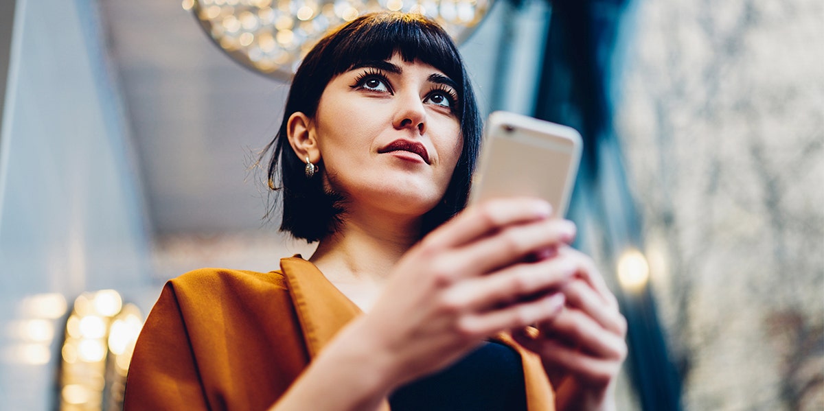What You See First In This Image Will Tell You What Kind Of Communicator You Are woman looking at phone