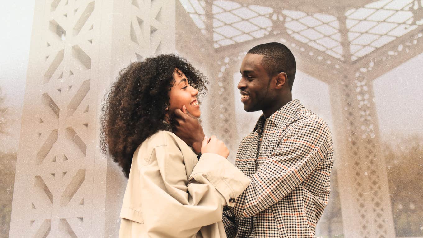 Couple on a date, man touching woman's face 