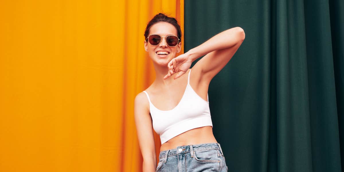 woman in sunglasses and smiling