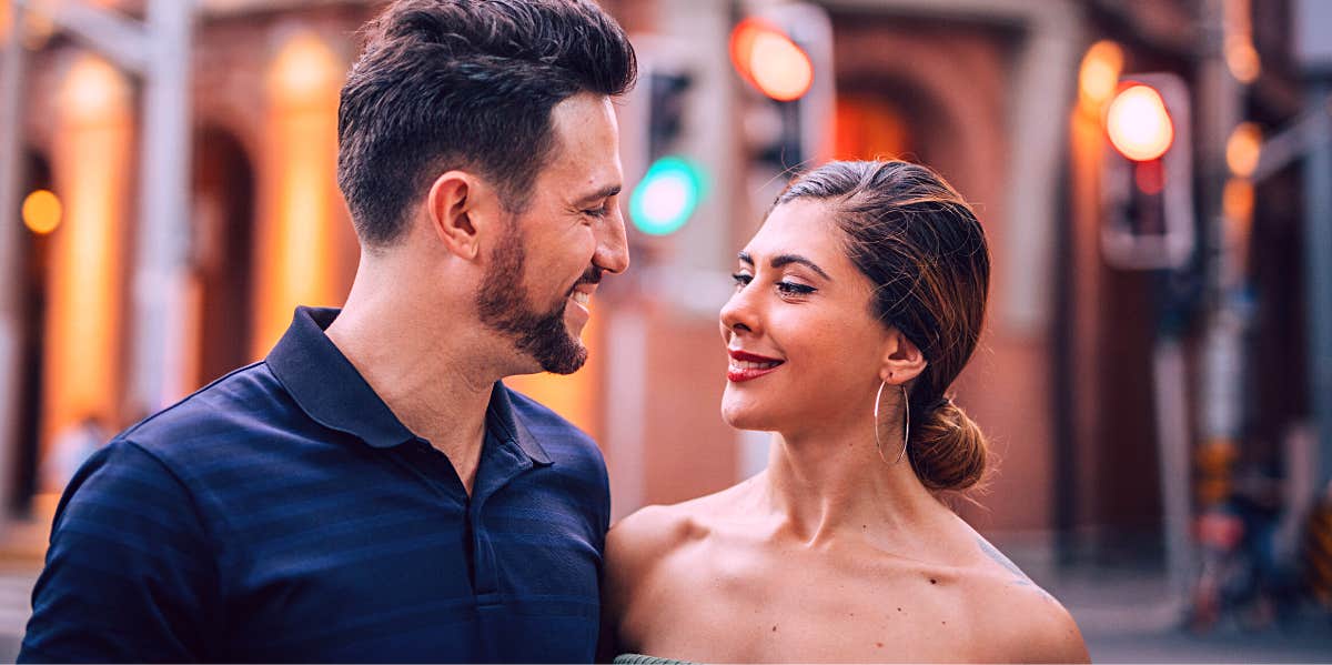 man smiling at attractive woman