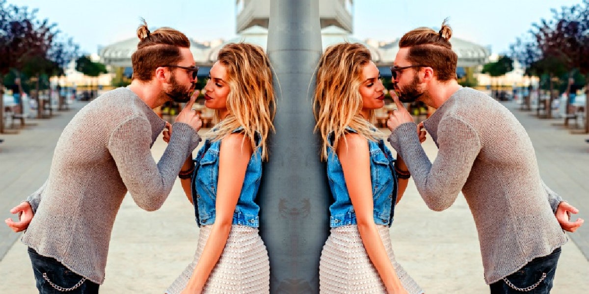 woman with attractive physical features standing with a man