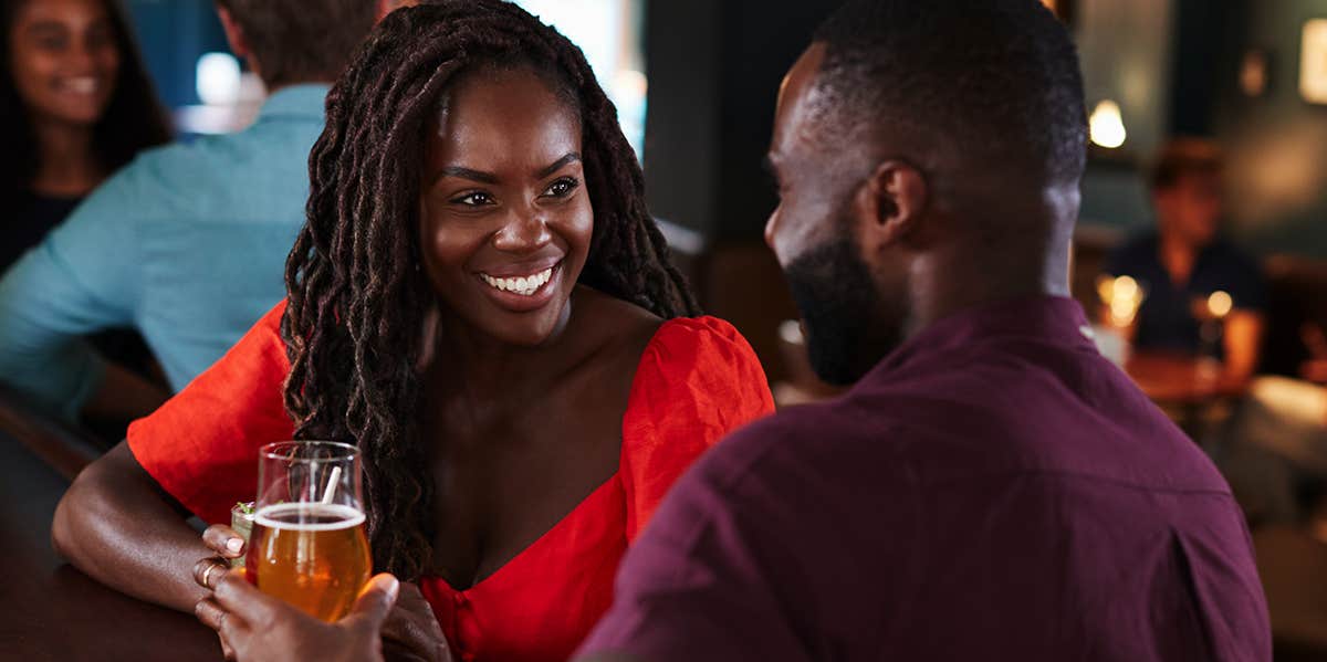 man and woman talking on date