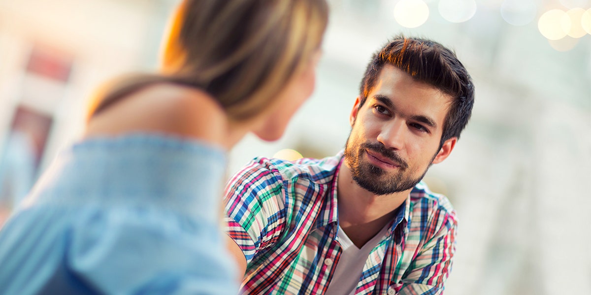 man looking at woman