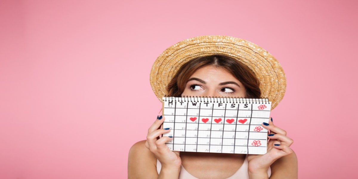 What Men Think About Periods & 7 Things They Think Happen During Menstruation woman holding period schedule